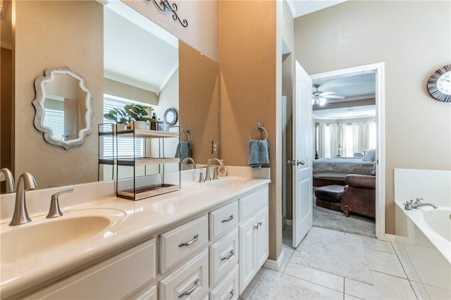 bathroom featuring vanity, crown molding, tile patterned flooring, a washtub, and ceiling fan