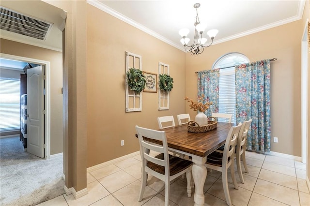 dining space with light carpet, a chandelier, and ornamental molding