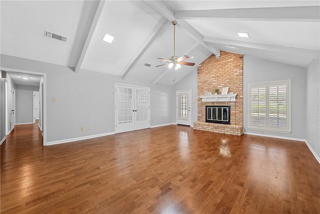 unfurnished living room with ceiling fan, a brick fireplace, beamed ceiling, high vaulted ceiling, and dark hardwood / wood-style floors