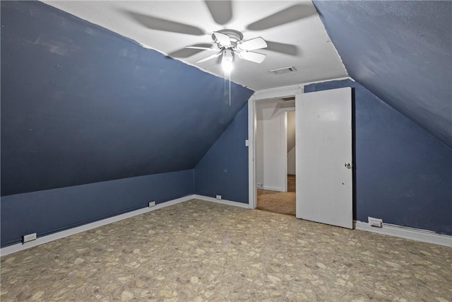 bonus room featuring a textured ceiling, ceiling fan, and lofted ceiling