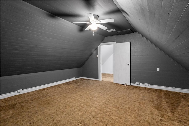 additional living space featuring ceiling fan, carpet floors, and vaulted ceiling