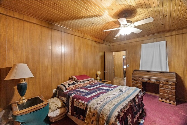 bedroom with carpet floors, ceiling fan, wooden walls, and wood ceiling