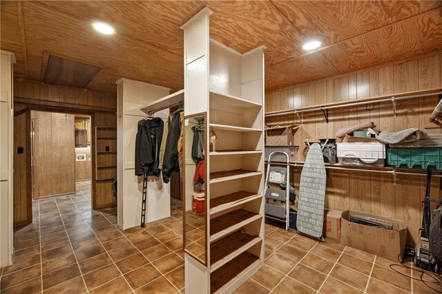 walk in closet featuring tile patterned flooring