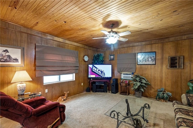 carpeted living room with a stone fireplace, wood walls, ceiling fan, and wood ceiling