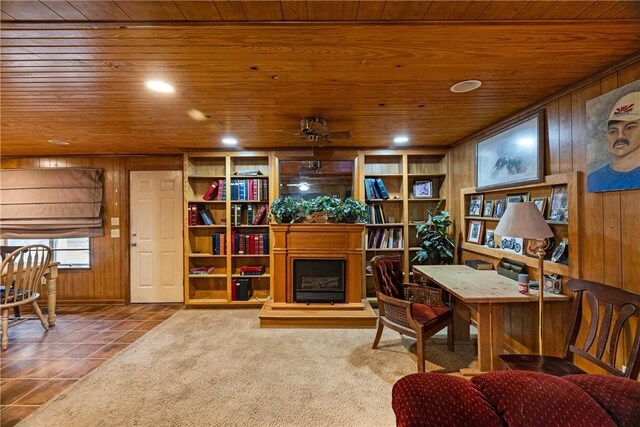 interior space featuring tile patterned flooring, wood walls, and wood ceiling