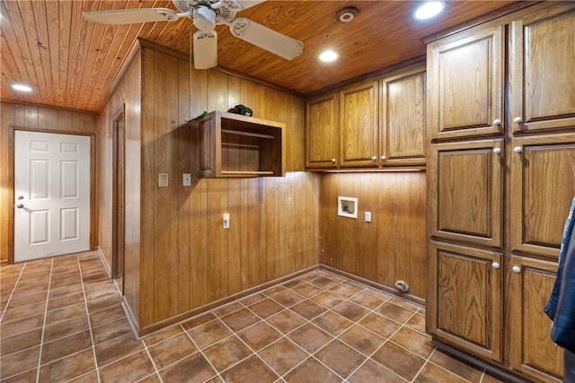 laundry area with cabinets, hookup for a washing machine, ceiling fan, wooden walls, and wooden ceiling