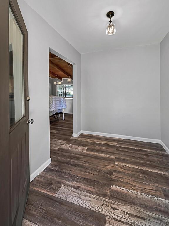 interior space with dark hardwood / wood-style flooring