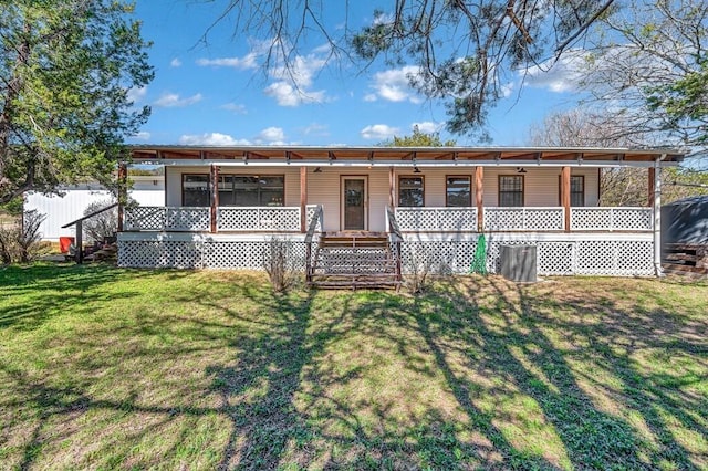 view of front facade featuring a front lawn and covered porch