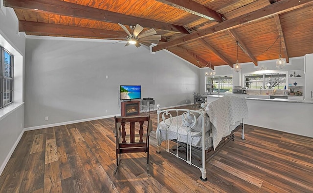 unfurnished dining area featuring lofted ceiling with beams, dark hardwood / wood-style floors, ceiling fan, a fireplace, and wood ceiling