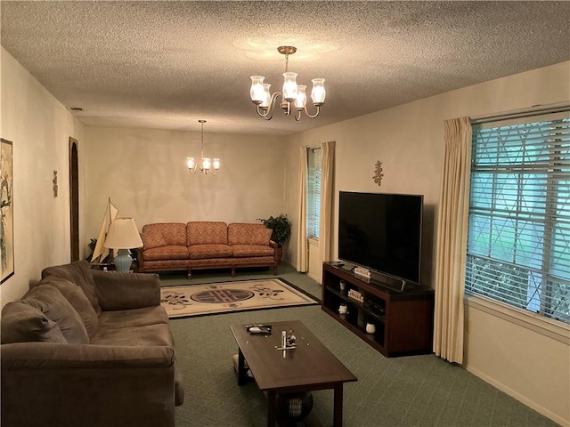 carpeted living room with a textured ceiling and a chandelier