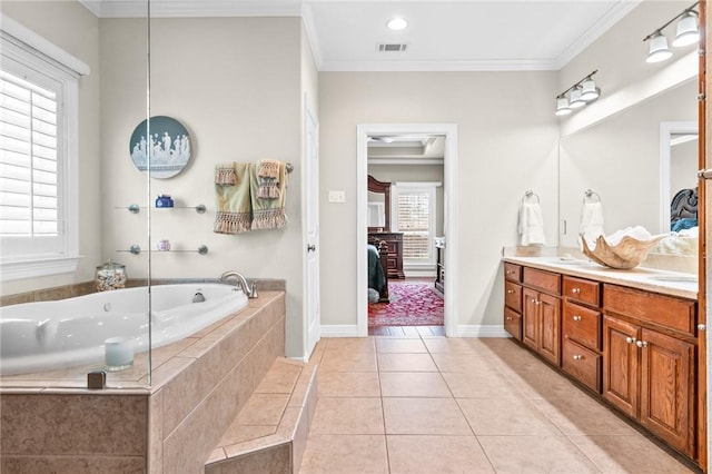 bathroom featuring tile patterned floors, double vanity, ensuite bathroom, and ornamental molding