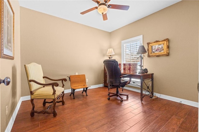 office space featuring baseboards, wood finished floors, and a ceiling fan