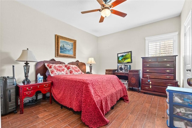 bedroom featuring ceiling fan and wood finish floors