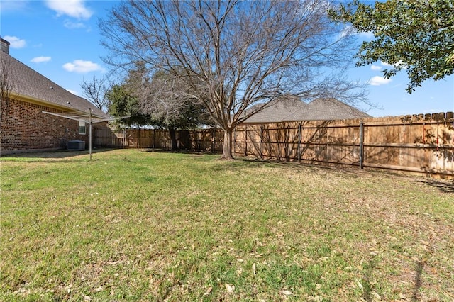 view of yard with a fenced backyard