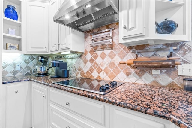 kitchen featuring white cabinetry, open shelves, black electric cooktop, and wall chimney exhaust hood