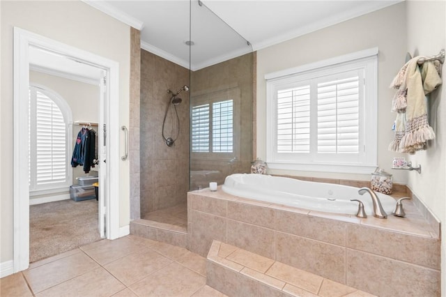 bathroom with tile patterned floors, a garden tub, tiled shower, and ornamental molding