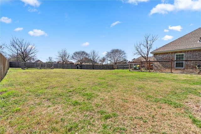 view of yard featuring a fenced backyard