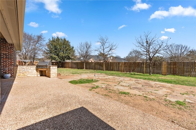 view of yard featuring a patio, area for grilling, and a fenced backyard