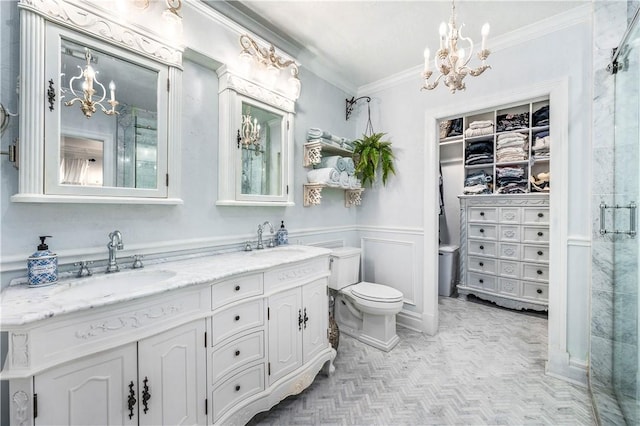 bathroom featuring vanity, toilet, walk in shower, and ornamental molding