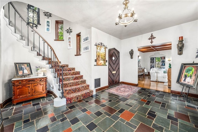 foyer featuring a notable chandelier