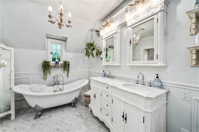 bathroom with a washtub and vanity