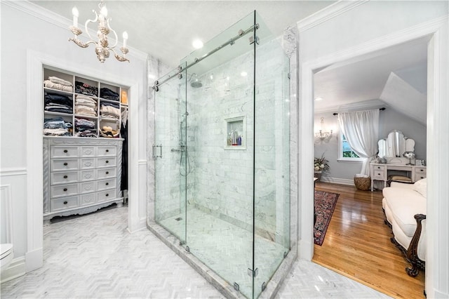 bathroom featuring a shower with door, wood-type flooring, and crown molding