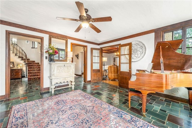 interior space featuring ceiling fan and ornamental molding