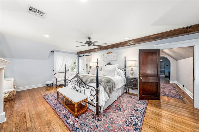 bedroom with ceiling fan and light hardwood / wood-style flooring