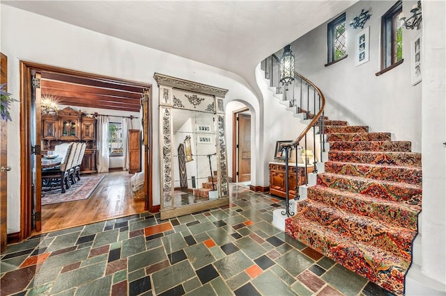 foyer entrance with dark wood-type flooring