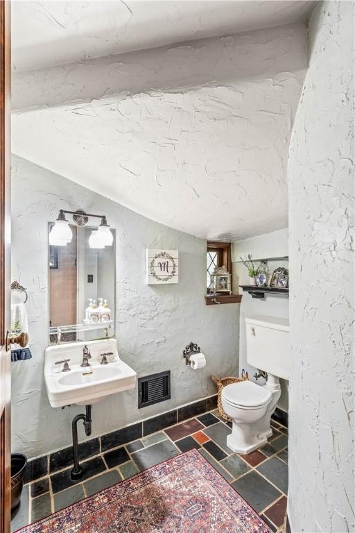 bathroom with toilet and sink