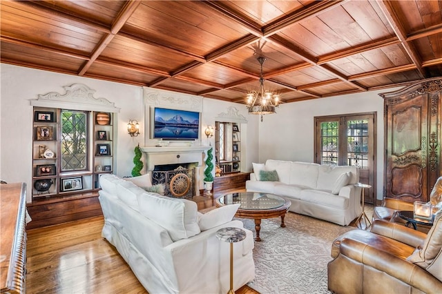 living room with a healthy amount of sunlight and wooden ceiling