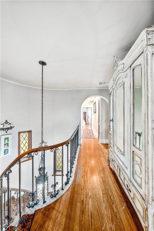 hallway with light hardwood / wood-style floors