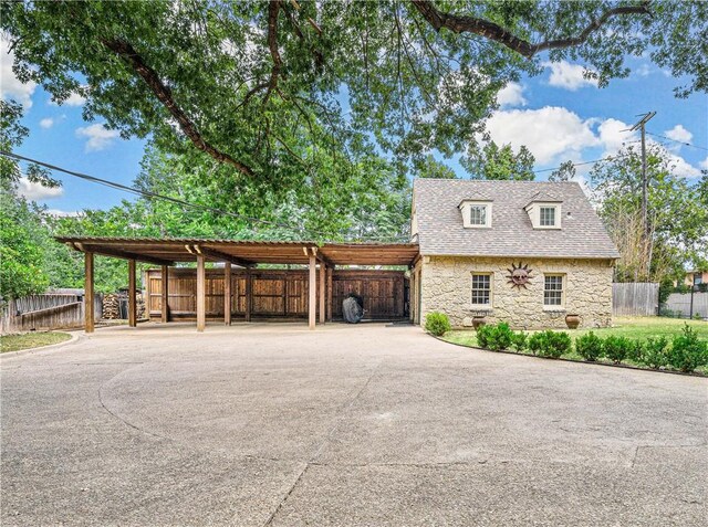 view of side of home featuring a carport