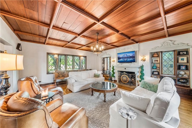 living room featuring hardwood / wood-style floors, a notable chandelier, wooden ceiling, and beamed ceiling