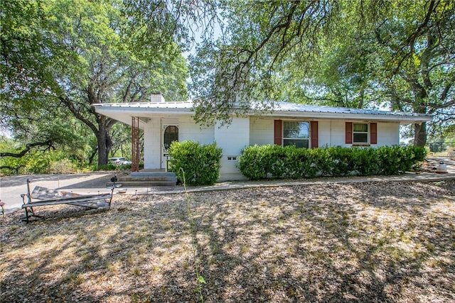 ranch-style house with a carport