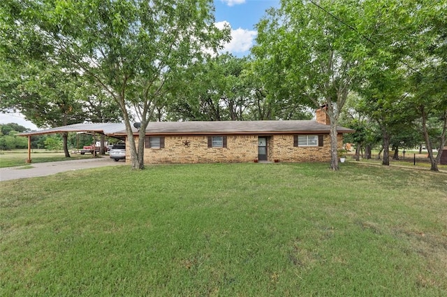 ranch-style house featuring a front yard and a carport