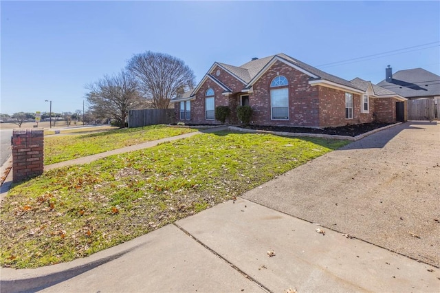 ranch-style house with a front lawn