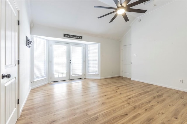 unfurnished room featuring french doors, ceiling fan, lofted ceiling, and light hardwood / wood-style floors