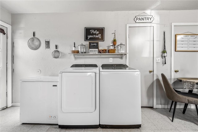 laundry area with independent washer and dryer