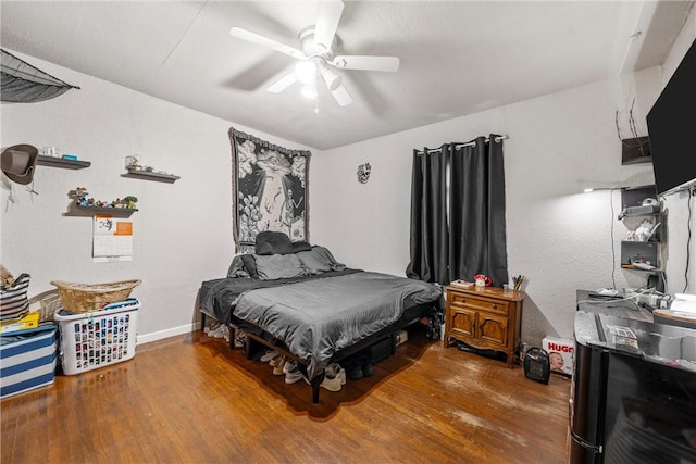 bedroom with hardwood / wood-style flooring and ceiling fan