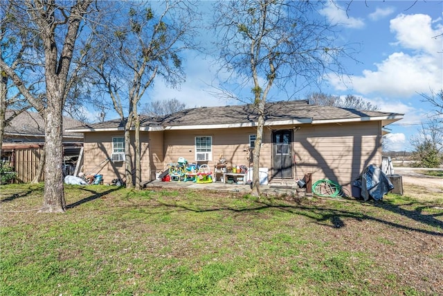 back of property featuring a yard and a patio area