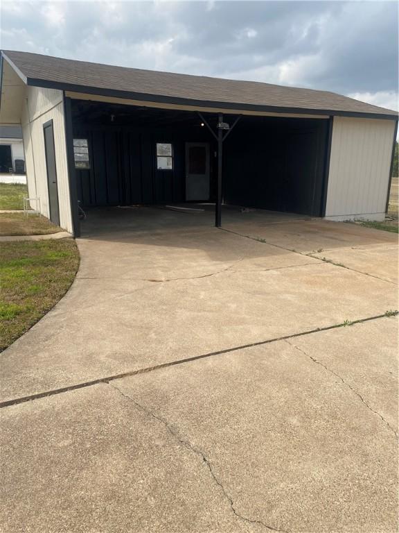 garage with a carport