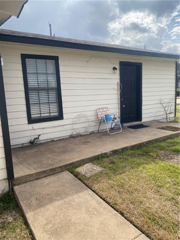 doorway to property featuring a patio