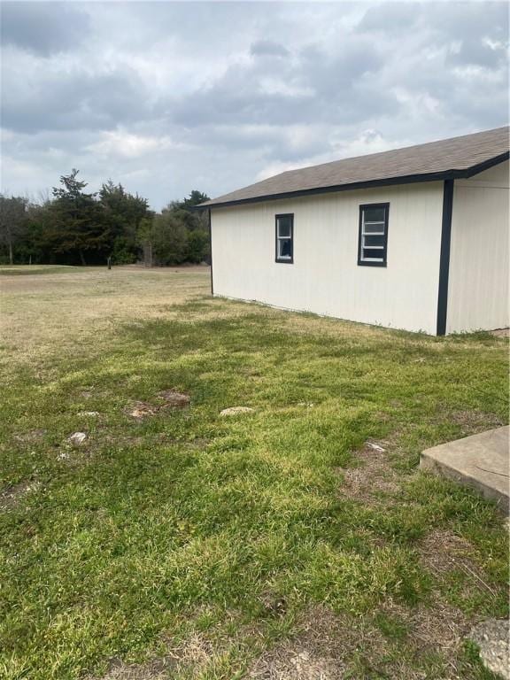 view of home's exterior with a lawn