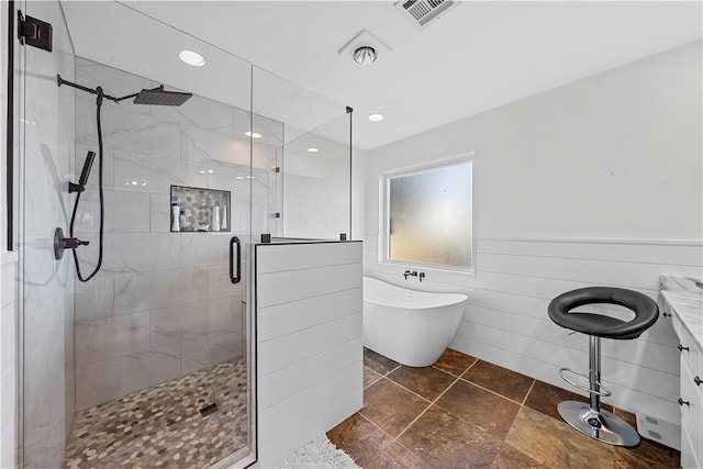 bathroom with plus walk in shower and vanity