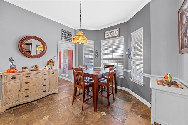 dining area featuring crown molding