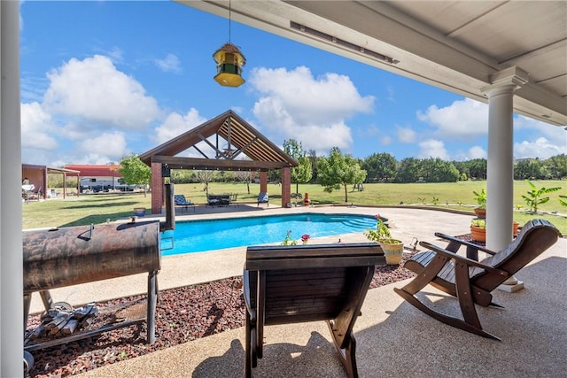 view of pool featuring a gazebo, a lawn, and a patio