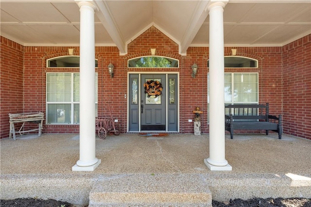 entrance to property featuring a porch