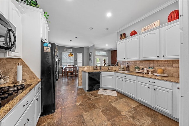 kitchen featuring white cabinetry, hanging light fixtures, kitchen peninsula, crown molding, and black appliances