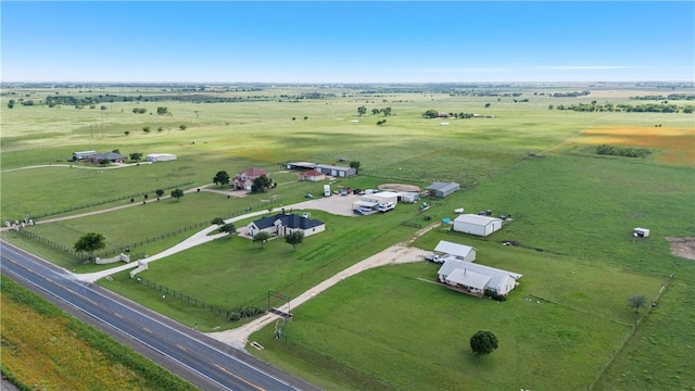 birds eye view of property featuring a rural view